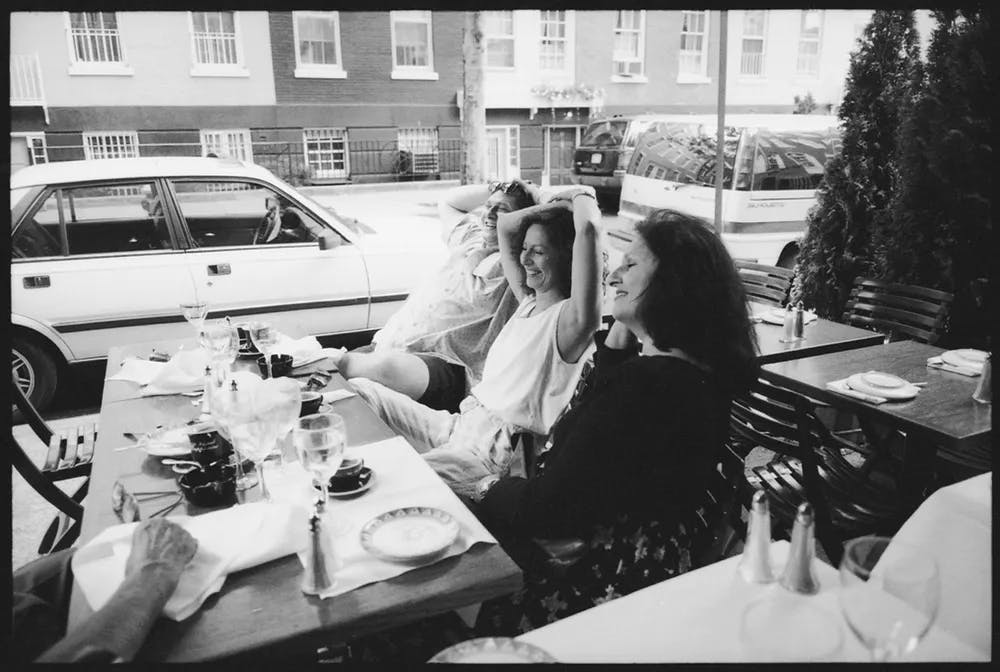 a person sitting at a table in a restaurant