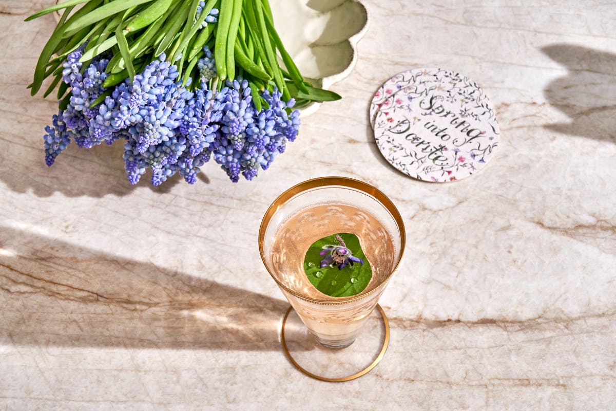a piece of broccoli on a cutting board with a cake