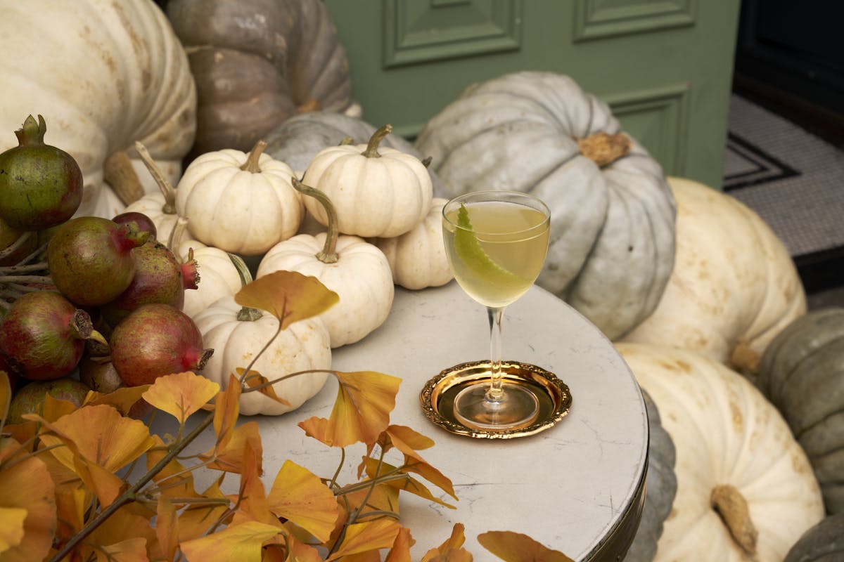 a bowl of fruit sitting on a table
