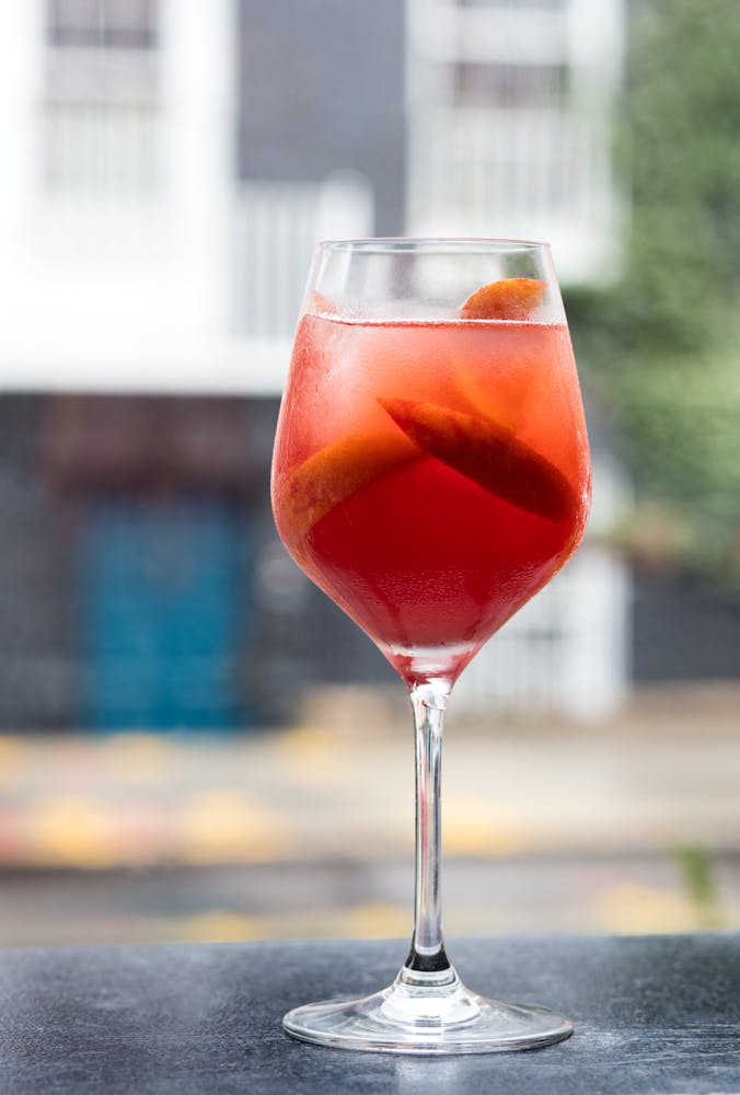 a close up of a glass of red wine
