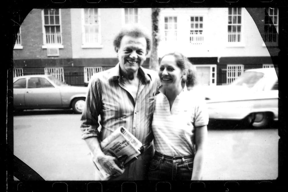 a man standing in front of a building