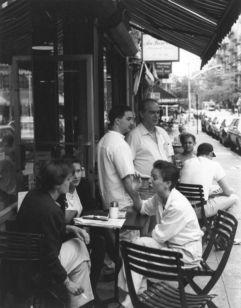 a group of people sitting at a table in a restaurant