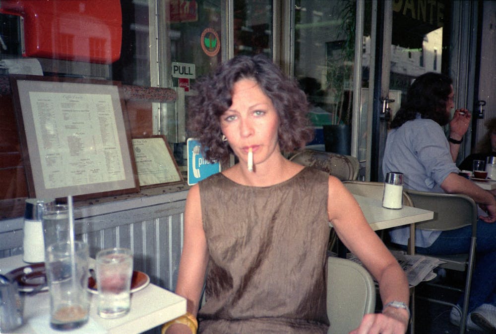 a person sitting at a table in a restaurant